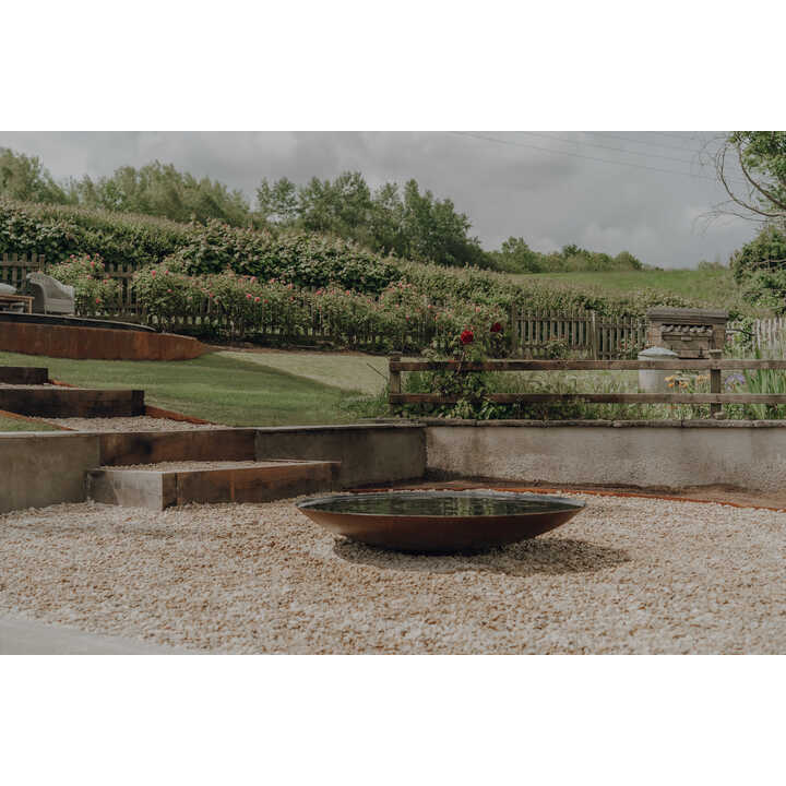 Planting border and seating area, sloping garden, Weare, Axbridge