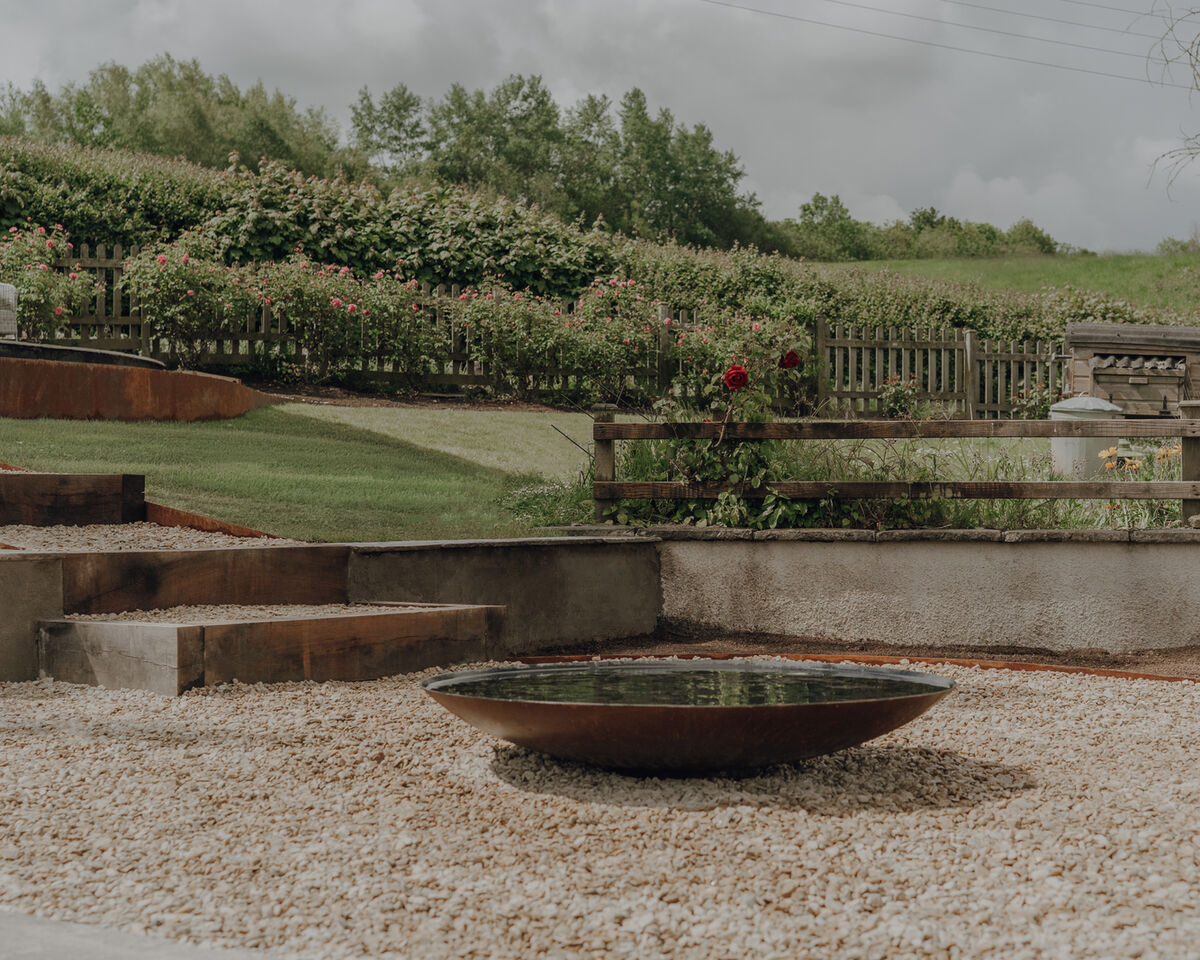 Planting border and seating area, sloping garden, Weare, Axbridge