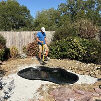New pond liner installed in the excavated area during the build